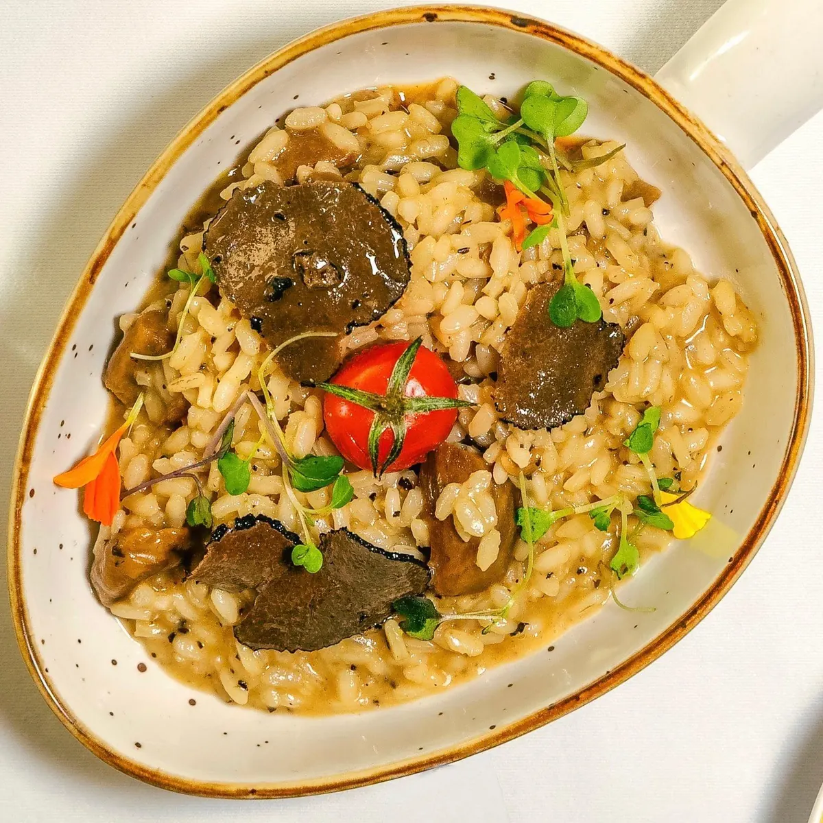 Risotto with mushrooms, black truffle and a roasted cherry tomato