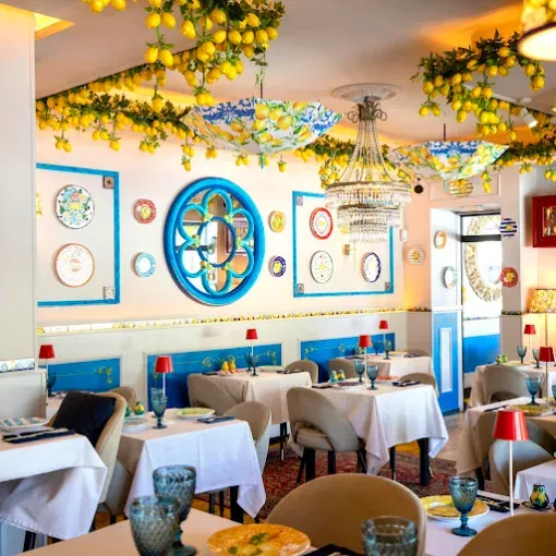 The dining room's blue rosette mirror and painted plates