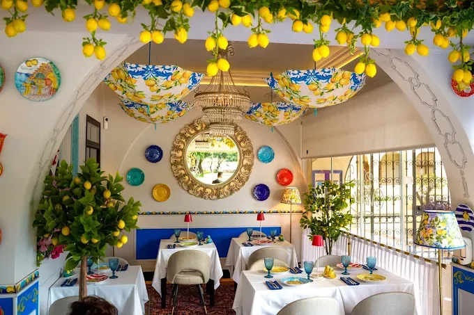 Lemon garlands and lemon-print parasols over the dining room